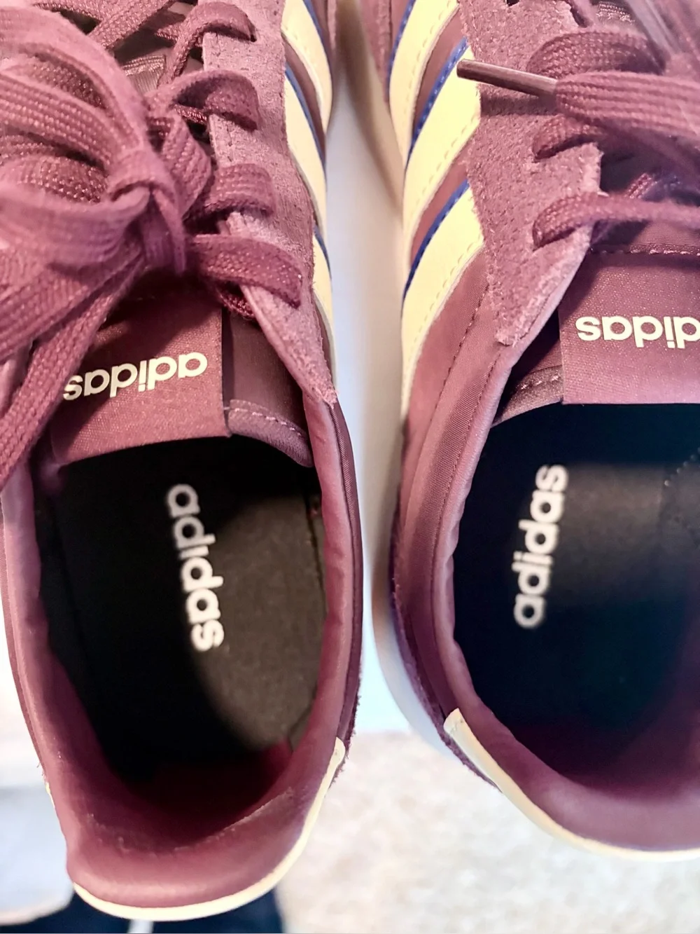 adidas burgundy and white suede sneakers with blue stripe accents